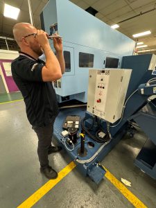 Oemeta engineer Ryan Aviles on-site testing customer fluid with a refractometer